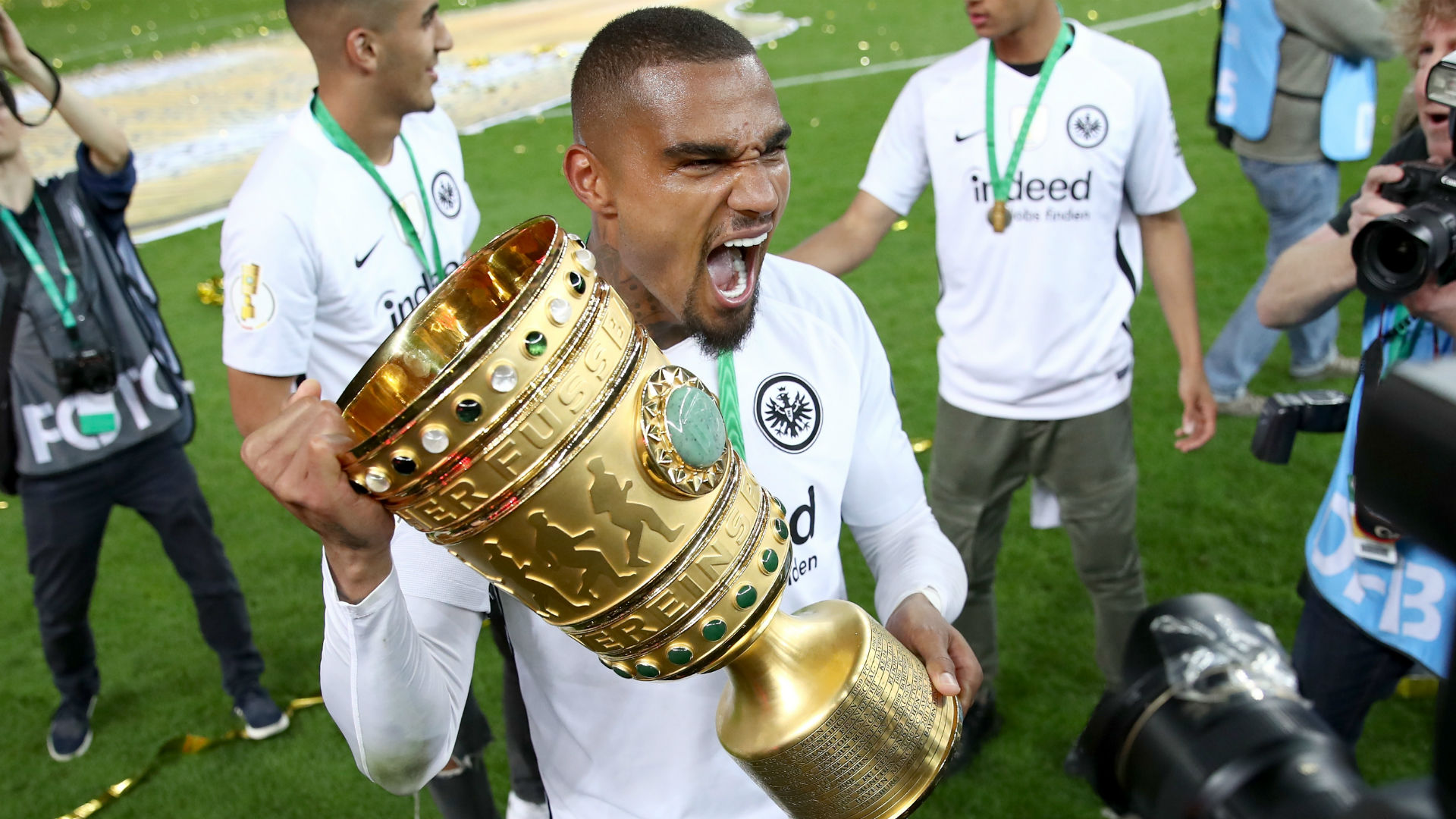 Kevin-Prince Boateng lifting the DFB-Pokal trophy